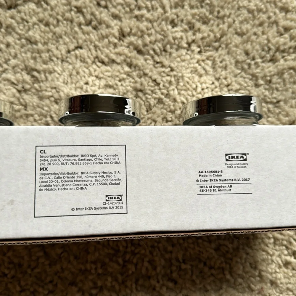 IKEA set of four Rajtan glass spice jars with silver lids
